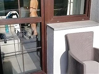 I spy on my neighbor and play with my cock. She opens the door and starts playing with his cock too.